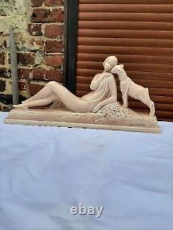 Art Deco ODYV faience statue. Woman lying with kid