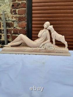 Art Deco ODYV faience statue. Woman lying with kid