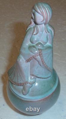 Beautiful vase covered in Art Deco style depicting a woman in a backless dress