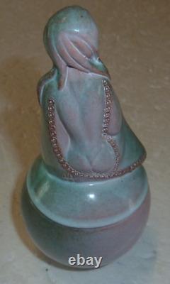 Beautiful vase covered in Art Deco style depicting a woman in a backless dress