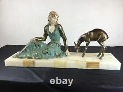 Important Art Deco sculpture representing a woman nurturing a deer