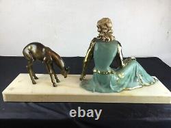 Important Art Deco sculpture representing a woman nurturing a deer