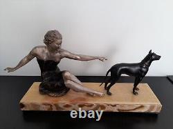 Woman with dog. Art Deco sculpture in spelter on a marble base