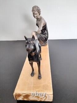 Woman with dog. Art Deco sculpture in spelter on a marble base