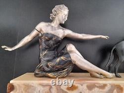 Woman with dog. Art Deco sculpture in spelter on a marble base