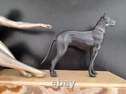 Woman with dog. Art Deco sculpture in spelter on a marble base