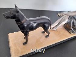 Woman with dog. Art Deco sculpture in spelter on a marble base